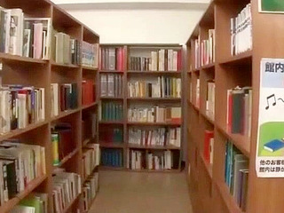 Japanese college teacher fingers mature librarian's pussy while on duty